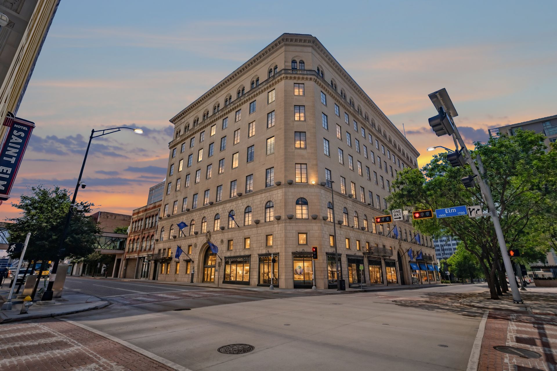 The 1929 Titche-Goettinger Building at 1900 Elm Street at dusk, home of 1900 Elm Lofts in downtown Dallas