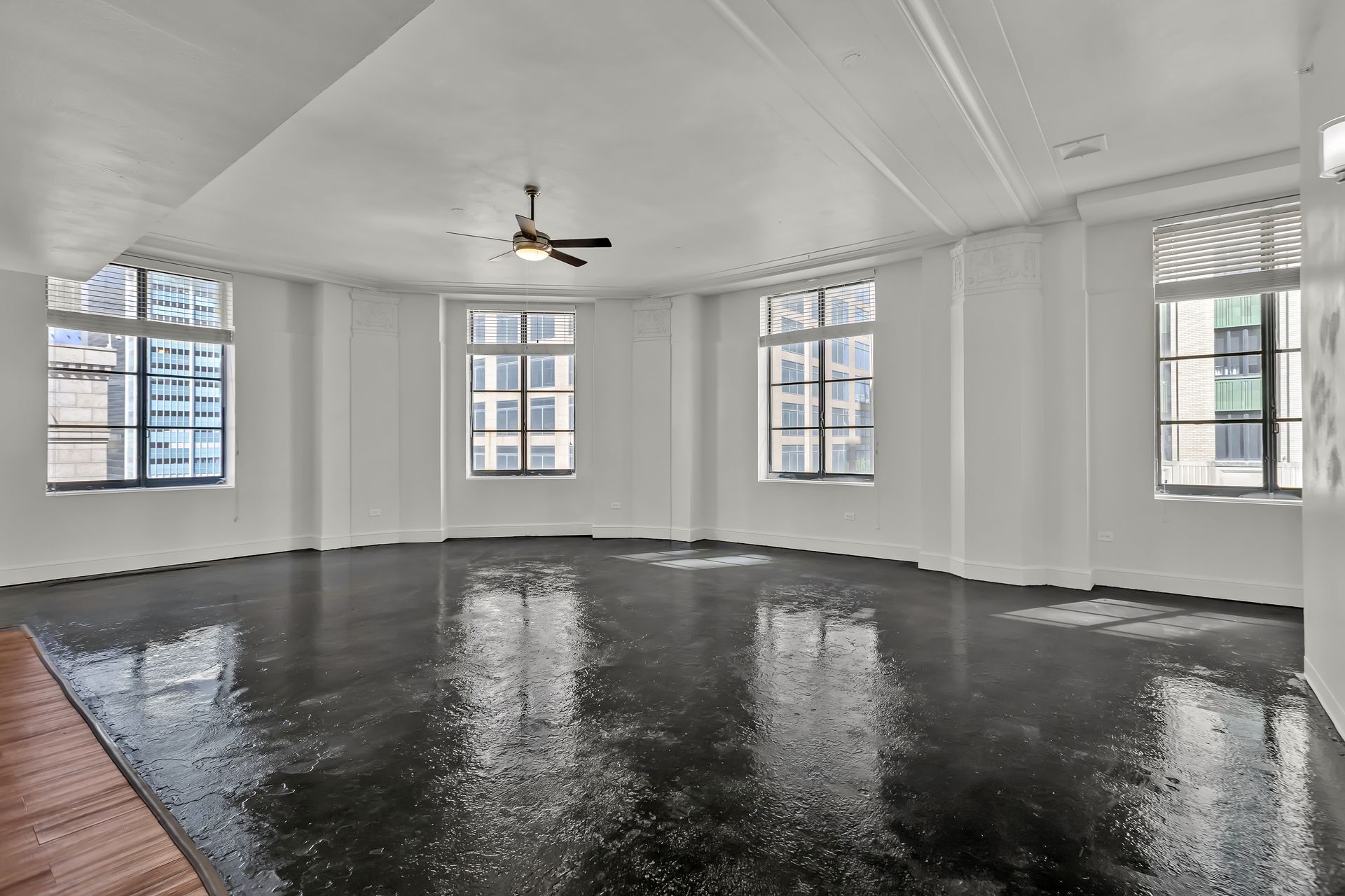 Grand Loft 416 corner living area with four windows over downtown Dallas